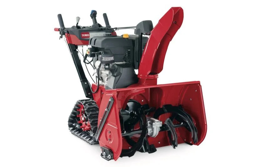 “Toro TRX HD 32-inch snowblower with tank treads on snowy ground”